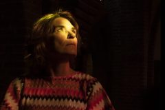 “Fine art portrait of strong woman in a minimal setting, focusing on stillness, light, and presence.”