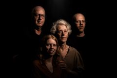Generations., Fine art family portrait of four generations illuminated with dramatic light against a dark background.