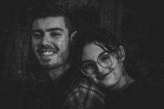 “Fine art portrait of loving couple in a forrest setting, focusing on stillness, love, light, and presence.”