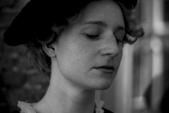 The Silent Reflection, Fine art black and white portrait of a young woman with closed eyes wearing historical clothing during the Rembrandt Days in Leiden, The Netherlands.