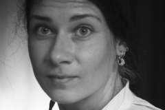 The Silent Gaze, Fine art black and white portrait of a young woman with expressive eyes wearing historical clothing during the Rembrandt Days in Leiden, The Netherlands.